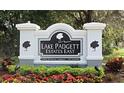 Lake Padgett Estates East community sign with lush landscaping and manicured flowerbeds at 4074 Parkway Blvd, Land O Lakes, FL 34639