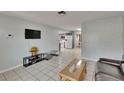 Comfortable living room showcasing an open floor plan and tile flooring at 5081 72Nd N Ave, Pinellas Park, FL 33781