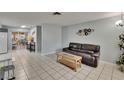 Open living room featuring tile floors, neutral paint, and easy access to the kitchen at 5081 72Nd N Ave, Pinellas Park, FL 33781