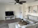 Bright living room with a ceiling fan, neutral tones, and stylish coastal decor at 5191 Salmon Se Dr # C, St Petersburg, FL 33705