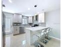 Bright kitchen featuring modern cabinetry, stainless steel appliances, and a stylish breakfast bar at 6268 39Th N Ave, St Petersburg, FL 33709
