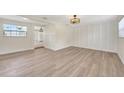 Bright living room with light wood floors, offering a spacious and versatile living area at 918 Skyview Dr, Brandon, FL 33510