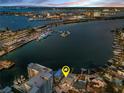 Waterfront home with dock, boat lift, and expansive views of the bay and marina at 94 Devon Dr, Clearwater Beach, FL 33767