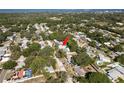Aerial view of a residential neighborhood, showing the property's location among mature trees near the bay at 1152 Jackmar Rd, Dunedin, FL 34698