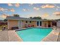 Private backyard oasis with a sparkling pool, perfect for relaxation and entertaining at 11665 Leisure W Ln, Largo, FL 33773