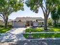 Beautiful single-story home with a well-maintained lawn and mature trees in a desirable neighborhood at 1910 Elk Spring Dr, Brandon, FL 33511
