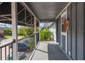 Condo balcony featuring black iron railings, and gray painted siding at 200 Country Club Dr # 906, Largo, FL 33771