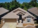 Aerial view of a single-Gathering home with a well-maintained roof and manicured landscaping at 2604 Clareside Dr, Valrico, FL 33596