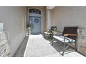 Charming front porch with seating, a neutral rug, and decorative touches, creating an inviting entrance at 2604 Clareside Dr, Valrico, FL 33596