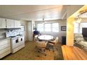 Charming kitchen with a window view to the outside and dining space at 37135 Sandra Ave, Zephyrhills, FL 33542