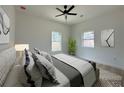 Cozy bedroom featuring a ceiling fan, ample natural light, and contemporary decor at 4920 72Nd N St, St Petersburg, FL 33709