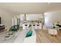 Open-concept living room flows into the kitchen with a large island and modern appliances at 4920 72Nd N St, St Petersburg, FL 33709