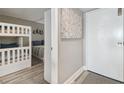Cozy bedroom with a bunk bed, nautical decor, and tile flooring, offering a comfortable space at 6009 Sea Ranch Dr # 107E, Hudson, FL 34667