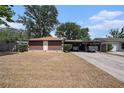 Single-story home featuring a carport and simple landscaping at 616 Highview S Cir, Brandon, FL 33510