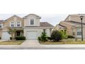 Inviting home with a well-manicured lawn and a two-car attached garage at 6260 Olivedale Dr, Riverview, FL 33578