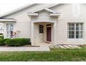 A welcoming entrance with a quaint porch and lush green landscaping at 6260 Olivedale Dr, Riverview, FL 33578