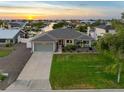 Charming single-story home featuring a well-maintained lawn, attached garage, and inviting curb appeal at 6604 Dolphin Cove Dr, Apollo Beach, FL 33572