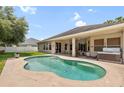 Outdoor pool with patio and covered area offering a relaxing backyard retreat at 11845 Newberry Grove Loop, Riverview, FL 33579