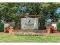 Elegant FishHawk Ranch sign with stone base and manicured flowerbeds at 15422 Starling Crossing Dr, Lithia, FL 33547