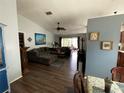Open living room featuring modern decor, hardwood floors, and ample natural light at 16035 Grass Lake Dr, Tampa, FL 33618