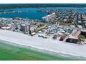 A scenic aerial view featuring the beach, shoreline and surrounding real estate at 17735 Gulf Blvd # 304, Redington Shores, FL 33708