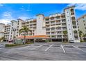 Well-maintained building featuring ample parking and landscaping at 17735 Gulf Blvd # 304, Redington Shores, FL 33708