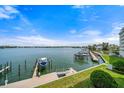 Scenic waterfront view featuring boat dock, lush greenery, and tranquil water, perfect for boating enthusiasts at 17735 Gulf Blvd # 304, Redington Shores, FL 33708