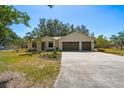 Beautiful home with a well-maintained lawn and a spacious two-car garage at 18902 Spring Hollow Dr, Lutz, FL 33559