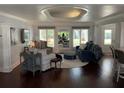 Bright living room with hardwood floors, recessed lighting, and stylish decor at 209 Rosery Rd, Belleair, FL 33756