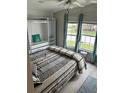 Cozy bedroom featuring updated closet space, and plenty of natural light at 21034 Lirio Dr, Land O Lakes, FL 34637