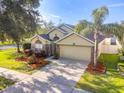 A high angle view of this beautiful single Gathering home with an expansive driveway and well-manicured lawns at 441 Thicket Crest Rd, Seffner, FL 33584
