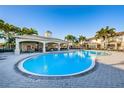 Community pool featuring a pavilion with ample seating and lounge chairs surrounding the deck at 6902 47Th N Ln, Pinellas Park, FL 33781
