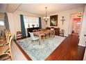 Bright dining area with a wooden table, area rug, and lovely decor at 7120 Early Gold Ln, Riverview, FL 33578