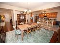 Elegant dining room featuring wood table, chairs, and decorative lighting at 7120 Early Gold Ln, Riverview, FL 33578