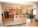 Modern kitchen with breakfast bar and stainless steel appliances at 7120 Early Gold Ln, Riverview, FL 33578