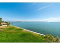 Scenic water view featuring calm blue waters, lush grass, and inviting scenery at 7500 Sunshine Skyway S Ln # 201, St Petersburg, FL 33711