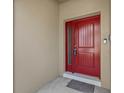 Close-up of the stunning red front door at 800 Callista Cay Loop, Tarpon Springs, FL 34689