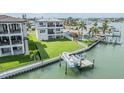 Stunning waterfront property with a private dock and boat lift, perfect for enjoying the water views at 16025 Redington Dr, Redington Beach, FL 33708