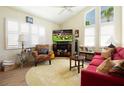 Bright living room featuring vaulted ceilings, modern plantation shutters, and a comfortable seating arrangement at 2101 Sunset Point Rd # 1806, Clearwater, FL 33765