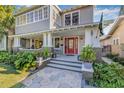 Close-up of the porch and entrance, including the red front door at 2628 2Nd N Ave, St Petersburg, FL 33713