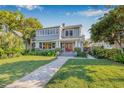 Beautiful two-story home with lush landscaping and a walkway leading to the front entrance at 2628 2Nd N Ave, St Petersburg, FL 33713