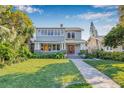 Inviting two-story home with a covered front porch and colorful front doors at 2628 2Nd N Ave, St Petersburg, FL 33713