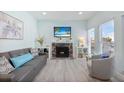 Relaxing living room featuring a cozy fireplace, comfortable seating, and stylish decor at 337 Rex Pl # G, Madeira Beach, FL 33708