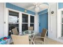 Inviting patio with seating, ceiling fan, and a view of the surroundings at 337 Rex Pl # G, Madeira Beach, FL 33708