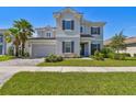 Charming two-story home with paver driveway and lush landscaping at 34084 Torrent Ln, Wesley Chapel, FL 33543