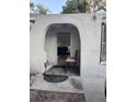 Charming front entrance with arched entryway and a glimpse of the interior at 3713 E Clifton St, Tampa, FL 33610