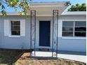 Inviting home entrance featuring an ornate metal porch and welcome mat at 5660 86Th N Ave, Pinellas Park, FL 33782