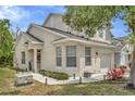 Charming house with a covered porch, landscaped garden, and a one car garage at 6233 Olivedale Dr, Riverview, FL 33578