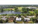 Aerial view of the property near a lake, park with baseball field, and other community amenities at 6415 13Th N Ave, St Petersburg, FL 33710