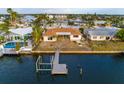 Waterfront home featuring a dock and expansive water views, perfect for enjoying the Florida lifestyle at 6442 Lake Sunrise Dr, Apollo Beach, FL 33572